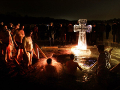 Unexpected baptism: 70 get an ice-cold dip during Orthodox celebrations