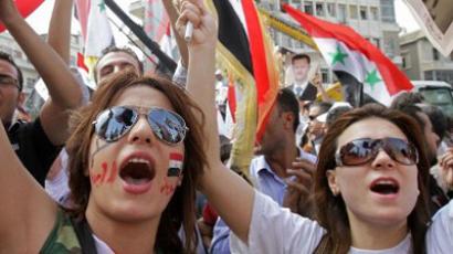 Supporters of Syrian President Bashar al-Assad shout slogans during a pro-regime rally in Damascus on October 12, 2011 (AFP Photo / Louai Beshara)