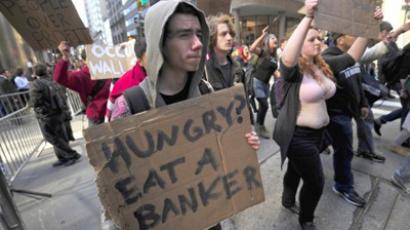 Participants in the Occupy Wall Street demonstrate on Wall Street, in an attempt to disrupt pedestrian flow for financial workers to get to work, in New York, September 19, 2011 (AFP Photo / Emmanuel Dunand)
