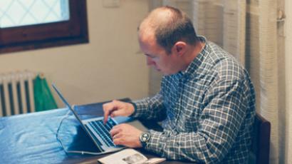 Man working on laptop (AFP Photo/Getty Images)