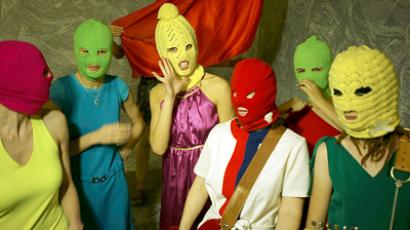 Pussy Riot supporters wearing the band's trademark colored balaklavas