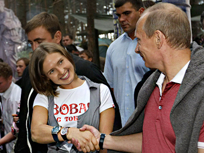 Putin promises to lose weight, ride a tandem bicycle with Medvedev