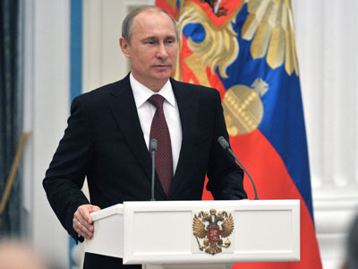 Putin 'will sign' bill banning US adoptions of Russian kids