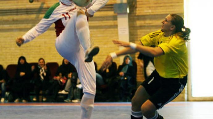 Iran's female footballers in action after head scarf ban 