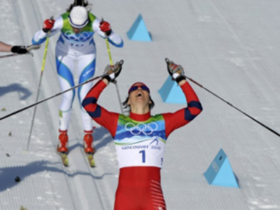 Bjoergen becomes three-time Olympic champ
