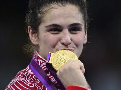 Golden gift: Olympic champ presents SUV to first coach
