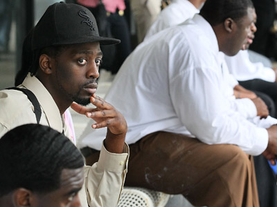 Job seekers take a break outside after speaking with recruiters during career fair sponsored by the Chicago Urban League and State Representative La Shawn K. Ford at Malcolm X College (Scott Olson/Getty Images/AFP)