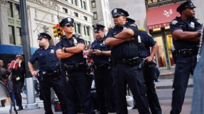 Police stand guard against demonstrators opposed to corporate profits on Wall Street during a march in the Financial District on September 26, 2011 New York City. (Spencer Platt/Getty Images/AFP )