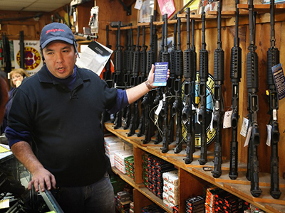 After the massacre: Major firm sells stake in rifle makers Bushmaster while gun sales surge