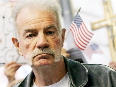 Koran-burning pastor plans armed rally at US mosque