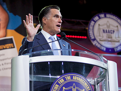Crowd boos as Romney slams ‘Obamacare’