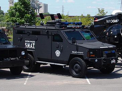 SWAT team fires semi-automatic weapons at unarmed teenage girl