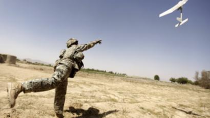 A US army soldier with the 101st Airborne Division Alpha Battery 1-320th tries to launch a drone outside Combat Outpost Nolen in the village of Jellawar in The Arghandab Valley (AFP Photo / Patrick Baz)