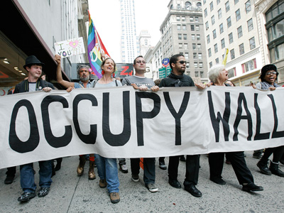 Occupy Wall Street to rubber stamp money with anti-corporate slogans
