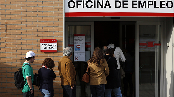 People enter a government-run employment office in Madrid May 6, 2013. (Reuters / Sergio Perez)