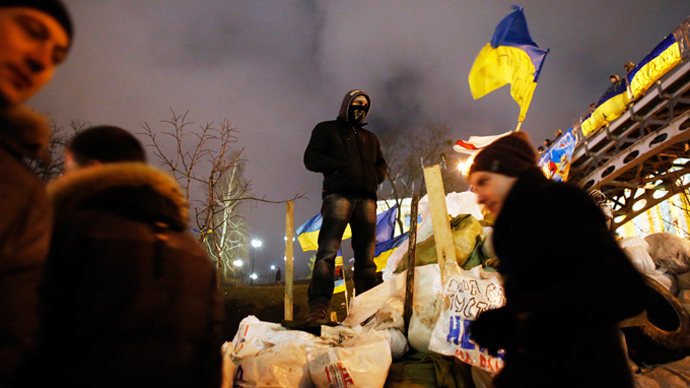 A pro-European integration protester stands on a barricade during a rally at Independence Square in Kiev December 17, 2013 (Reuters / Marko Djurica)
