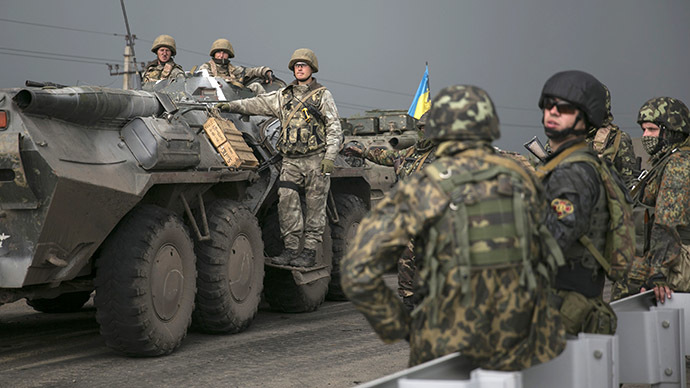 Ukrainian soldiers stand near an armored personnel carrier at a checkpoint near the town of Slavyansk in eastern Ukraine May 2, 2014. (Reuters / Baz Ratner)