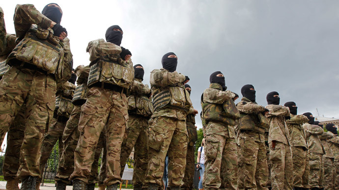 New volunteers of self-defence battalion "Azov" take an oath of allegiance to the country during a ceremony before leaving for regions of eastern Ukraine in Kiev, June 23, 2014. (Reuters / Valentyn Ogirenko)