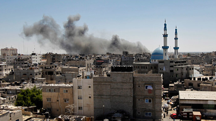Smoke billows from a building hit by an Israeli air strike in the town of Rafah, in the southern Gaza Strip.(AFP Photo / Said Khatib)
