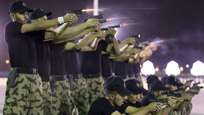 Members of the Saudi Police show their shooting skills during their graduation ceremony at the Public Security Training City in Riyadh (Reuters / Fahad Shadeed)