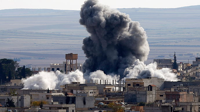 An explosion following an air strike is seen in western Kobani neighbourhood (Reuters / Osman Orsal)